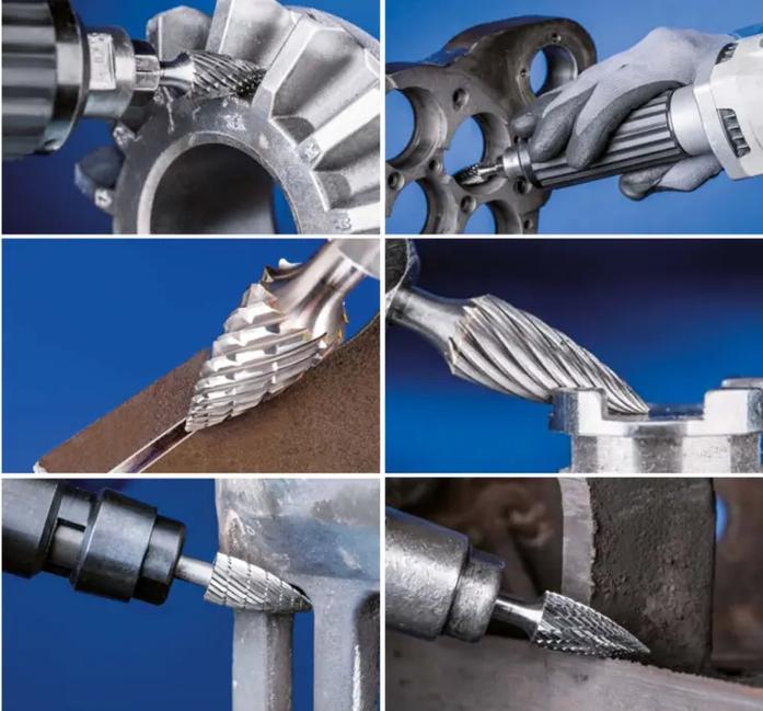 Various types of rotary files for steel arranged on a workbench, showing different shapes and sizes designed for specific industrial applications